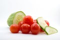 Macro Image of Sliced Cucumber and Mini Red Tomatoes Isolated on white Background Royalty Free Stock Photo