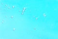 Macro image of small air bubbles suspended in bright turquoise liquid, creating a fresh, clean, and vibrant background Royalty Free Stock Photo