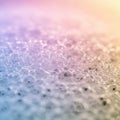 A macro image of soap bubbles with a delicate pastel gradient. The bubbles form an Royalty Free Stock Photo