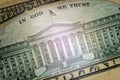 Macro. Image of the US Department of the Treasury Building and the inscription In God we trust. Part of the ten-dollar US bill on Royalty Free Stock Photo