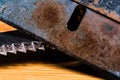 A Macro image of A very old, dull and rusty razor with an equally dirty and used serrated blade Royalty Free Stock Photo