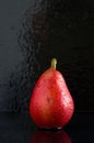 Macro Image of Wet Red Pear on Black Background Royalty Free Stock Photo