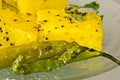 Macro of Indian Snacks Dhokla with fried chillies Royalty Free Stock Photo