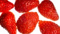 Macro isolated image of ripe sweet red strawberries over white backgorund. Abstract background of berries and fruits. Royalty Free Stock Photo