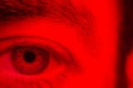 Macro on man eye expressing serious and expressionless expression Royalty Free Stock Photo