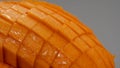 Macro Mango slice cut to cubes close-up isolated on light grey background Royalty Free Stock Photo