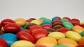 MACRO: Many colour candies on a white background