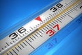 Macro of medical thermometer on blue