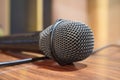 Macro microphone over wooden table Royalty Free Stock Photo