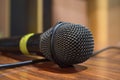 Macro microphone over wooden table Royalty Free Stock Photo