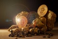 macro miner figures working on group of Bitcoin mining in deep golden cave Royalty Free Stock Photo