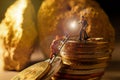 macro miner figures working on group of Bitcoin mining in deep golden cave Royalty Free Stock Photo