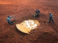 Macro miner figurines digging ground to uncover big shiny bitcoin