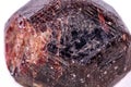 Macro of a mineral garnet stone on a white background