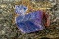 Macro mineral raw uncut blue sapphire crystal-close up Royalty Free Stock Photo