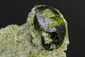 Macro mineral stone Andradite on a black background Royalty Free Stock Photo