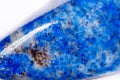 Macro mineral stone blue lapis lazuli afghanistan on white bac Royalty Free Stock Photo