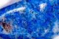 Macro mineral stone blue lapis lazuli afghanistan on white bac Royalty Free Stock Photo