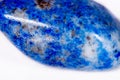 Macro mineral stone blue lapis lazuli afghanistan on white bac Royalty Free Stock Photo