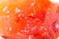 Macro mineral stone Carnelian on white background Royalty Free Stock Photo