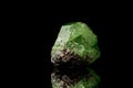 Macro mineral stone Demantoid on a black background Royalty Free Stock Photo