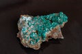 Macro mineral stone Dioptase on a gray background Royalty Free Stock Photo