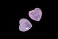 Macro mineral stone Heart pink quartz on a black background Royalty Free Stock Photo