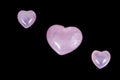 Macro mineral stone Heart pink quartz on a black background Royalty Free Stock Photo