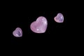 Macro mineral stone Heart pink quartz on a black background Royalty Free Stock Photo