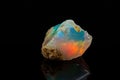 Macro mineral stone rare and beautiful opals on a black background Royalty Free Stock Photo