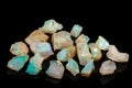 Macro mineral stone rare and beautiful opals on a black background Royalty Free Stock Photo