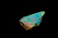 Macro mineral stone rare and beautiful opals on a black background Royalty Free Stock Photo