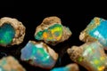 Macro mineral stone rare and beautiful opals on a black background Royalty Free Stock Photo