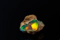 Macro mineral stone rare and beautiful opals on a black background Royalty Free Stock Photo