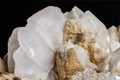 Macro mineral stone Snow quartz with calcite on a black background Royalty Free Stock Photo