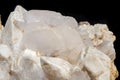 Macro mineral stone Snow quartz with calcite on a black background Royalty Free Stock Photo