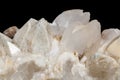 Macro mineral stone Snow quartz with calcite on a black background Royalty Free Stock Photo