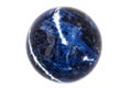 Macro mineral stone Sodalite ball on white background Royalty Free Stock Photo