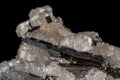 Macro mineral stone Stibnite quartz on a black background Royalty Free Stock Photo