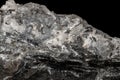 Macro mineral stone Stibnite quartz on a black background Royalty Free Stock Photo