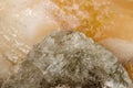 Macro mineral stone Stilbite on Apophyllite on a black background