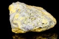 Macro mineral stone Sulfur on black background Royalty Free Stock Photo