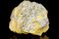 Macro mineral stone Sulfur on black background Royalty Free Stock Photo