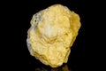 Macro mineral stone Sulfur on black background Royalty Free Stock Photo