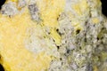 Macro mineral stone Sulfur on black background Royalty Free Stock Photo