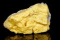 Macro mineral stone Sulfur on black background Royalty Free Stock Photo