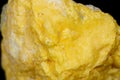 Macro mineral stone Sulfur on black background Royalty Free Stock Photo