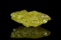 Macro mineral sulfur stone on a black background