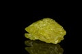 Macro mineral sulfur stone on a black background