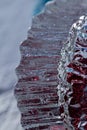 Macro modern art texture of bright abstract crystal glass reflecting brilliant red and silver color Royalty Free Stock Photo